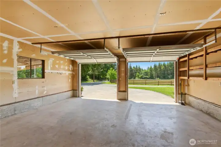 Attached to the residence is this spacious two-car garage. It's a clean slate ready for your storage systems, motorcycle storage, or vehicle parking. Attached to the residence is this spacious two-car garage. It's a clean slate ready for your storage systems, motorcycle storage, or vehicle parking.