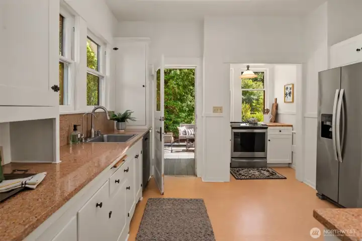 While maintaining the classic charm, this enormous kitchen features all the modern conveniences you would expect including stainless appliances and slab granite countertops.