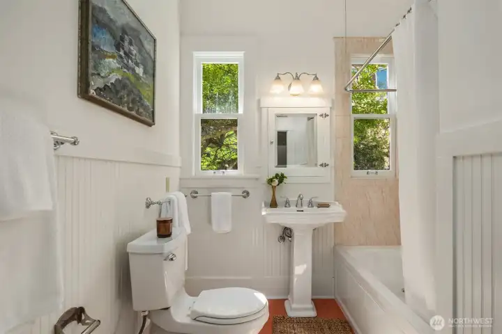 The main floor full bath is one of three bathrooms (one on each level).