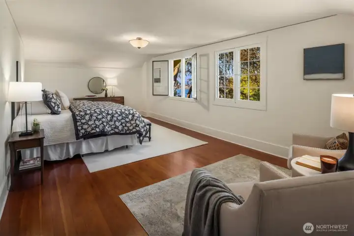 The primary bedroom located on the second floor is enormous with a walk-in closet and room for a king sized bedroom set plus a sitting room.