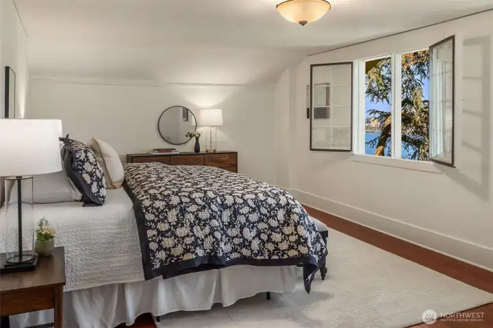 This enormous bedroom has more than enough room for a king sized bed that barely takes up half the bedroom.