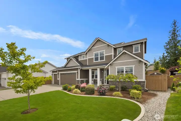Every detail feels intentional, right down to the landscaping that frames the home so beautifully.