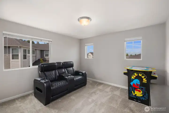 Tucked away from the main living spaces, this bonus room offers a comfortable retreat with plenty of room to relax, entertain, or enjoy your favorite hobbies.