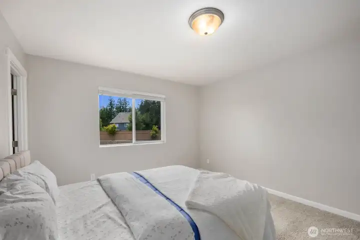 With direct access to an adjoining bathroom, this bedroom offers added privacy and convenience for guests or household members.