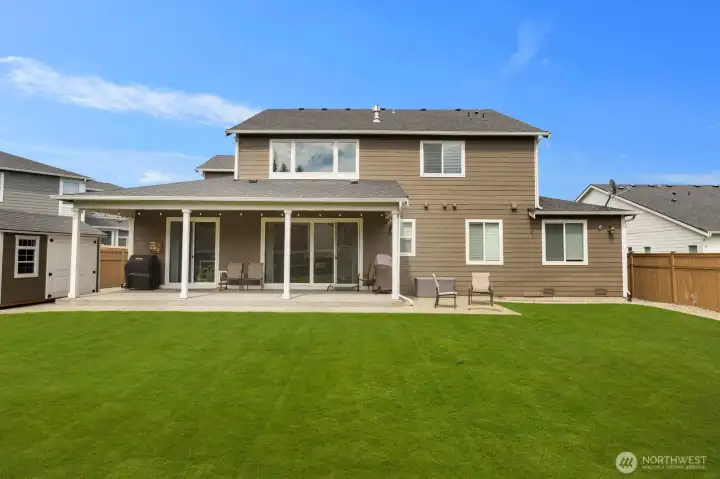 The backyard offers a rare combination of usable green space, mature landscaping, and multiple areas to relax and entertain.