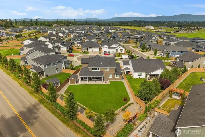 Set on an oversized homesite, this property stands out with an expansive backyard, extensive landscaping, and a covered outdoor living area designed to make the most of the space.