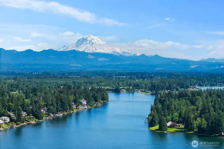 Sweeping views of the lake, tree-lined shorelines, and Mount Rainier create a breathtaking backdrop that defines the beauty of the surrounding region.