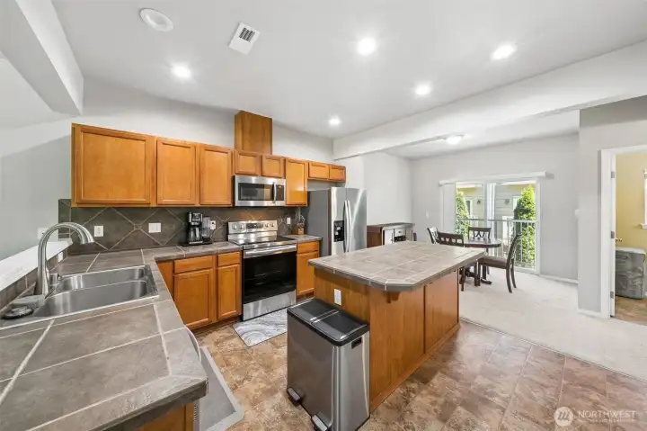 Good size kitchen with island and stainless steel appliances. Good size kitchen with island and stainless steel appliances.