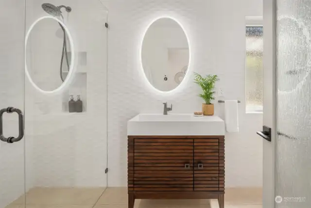 Main floor guest bath w/curbless shower and custom tile wall