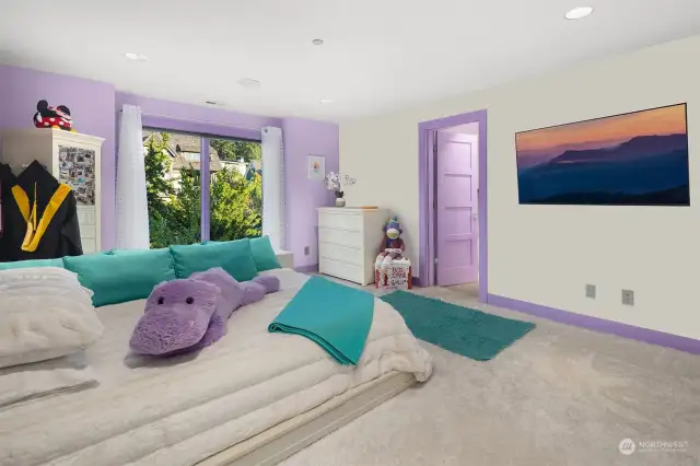 Guest bedroom on the upper level with ensuite bath.