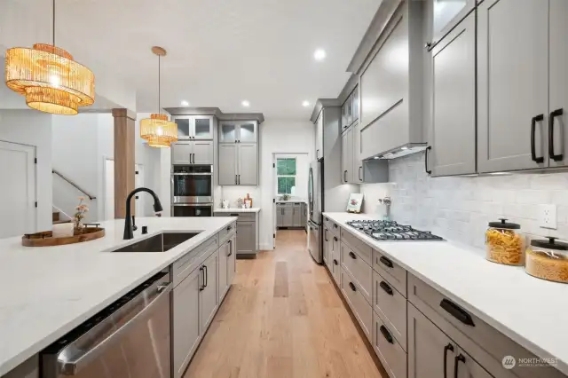 Stainless appliances and quartz countertops.