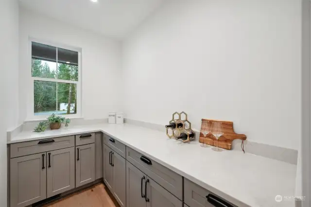 Large butlers pantry off the kitchen for extra storage plus a wine fridge.