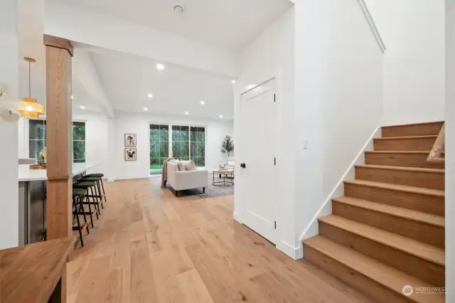 The entry way has a clear view towards the kitchen and great room at the back of the home.