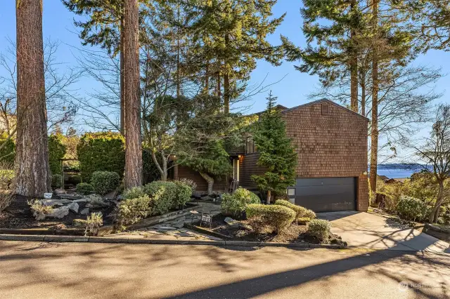 This sunny, elegant home sits on a large corner lot, where breathtaking views of Lake Washington, Mt. Rainier, and the Seattle and Bellevue skylines take center stage