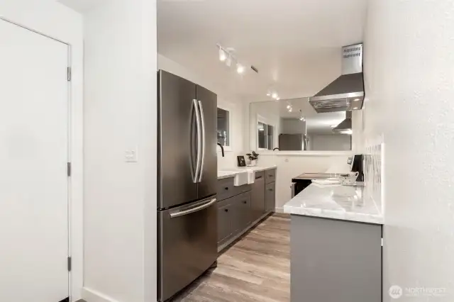 Lower Level Kitchen featuring Carrera marble countertops and more!