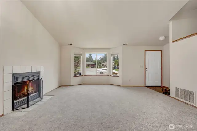 Living Room and Wood Burning Fireplace.