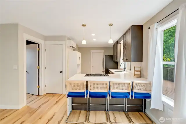 Lots of seating at the bar for your eat-in kitchen, awesome waterfall quartz countertops, deep kitchen sink. Easy access laundry room, with storage galore.