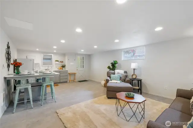 This gorgeous 15x27 room in the basement includes a kitchenette with refrigerator and microwave, the dooris a private entrance from the driveway. ADU? Generational living? Added living space?