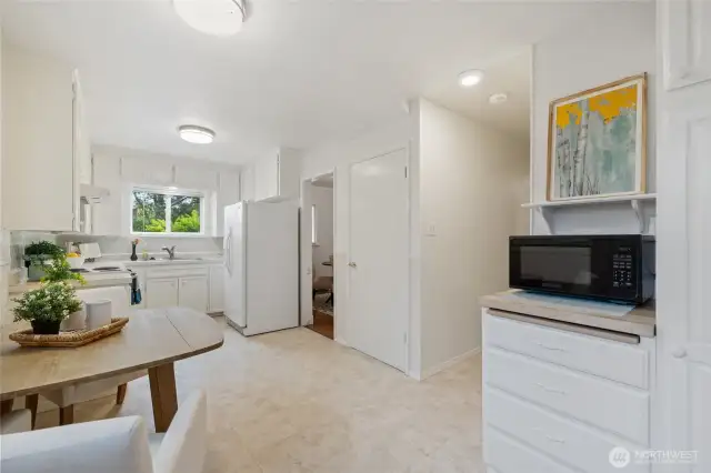 Large eat in kitchen, laundry is behind the photographers back! Washer and dryer remain with house