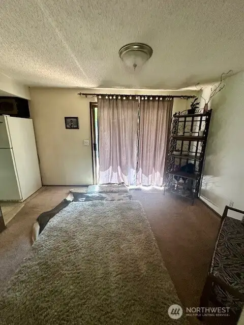 dining area off kitchen has slider to deck