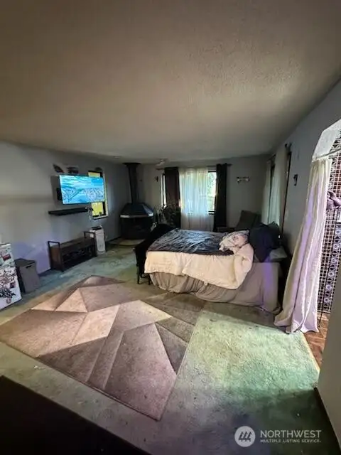 Huge master bedroom with Cozy wood stove