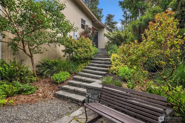 Stairs from backyard leading to carport