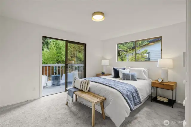 Primary suite opens to back yard with deck.