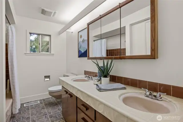 Shared bath with double vanity.