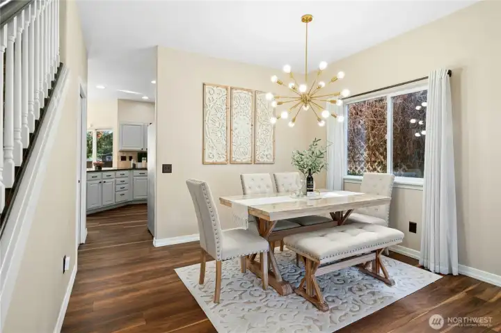 The formal dining room is accented with a window to let in the natural light.