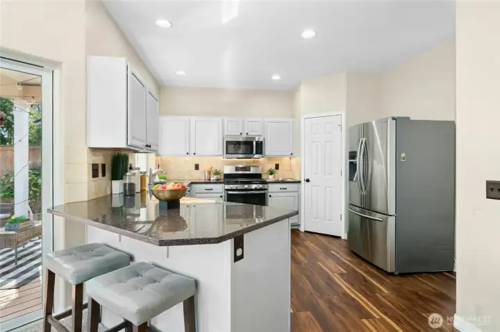 Open kitchen design with modern finishes and great flow.