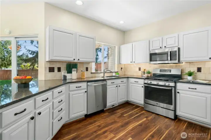 Granite countertops add style and durability. Stainless steel appliances including a new dishwasher (2024).