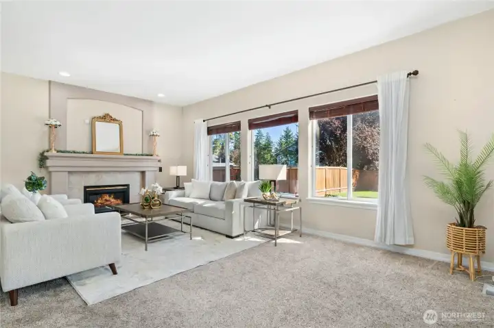 Family room with a cozy fireplace invites relaxation.