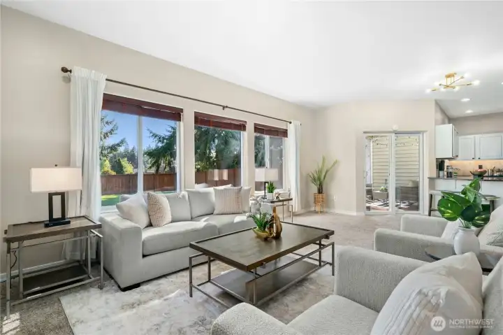 A row of windows overlooks the backyard.