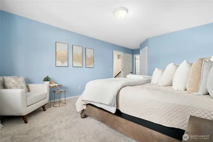 The primary suite boasts a private bath and walk-in closet.