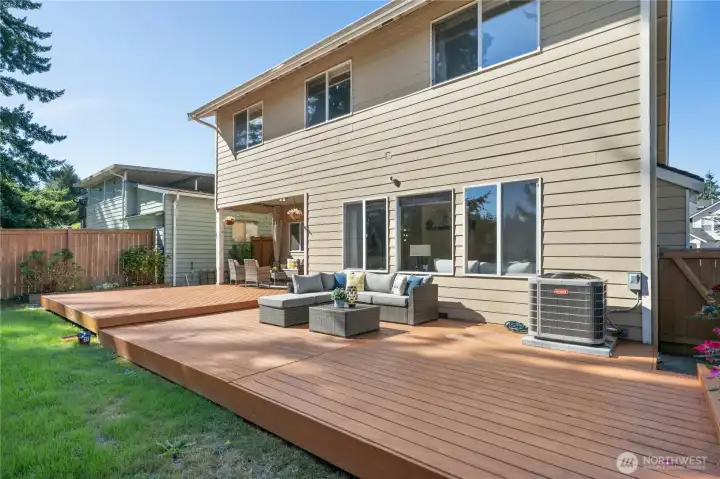 Fully fenced backyard designed for gatherings.