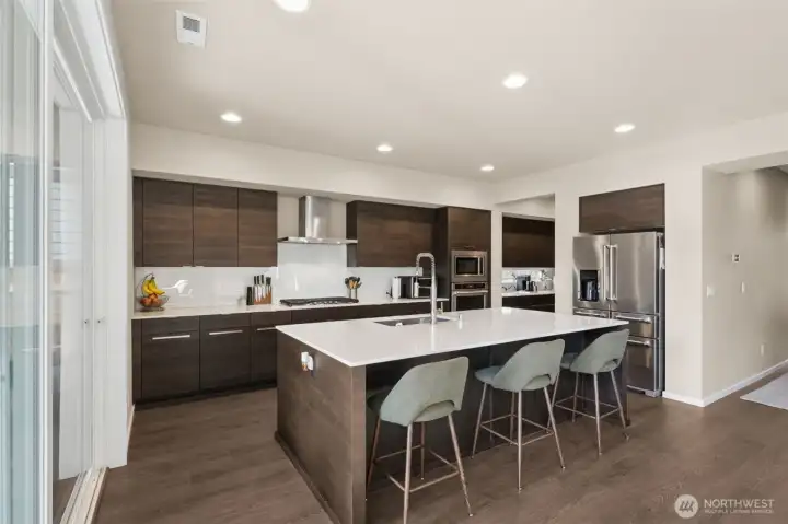 Kitchen with a peek at the grand butler's pantry in the distance