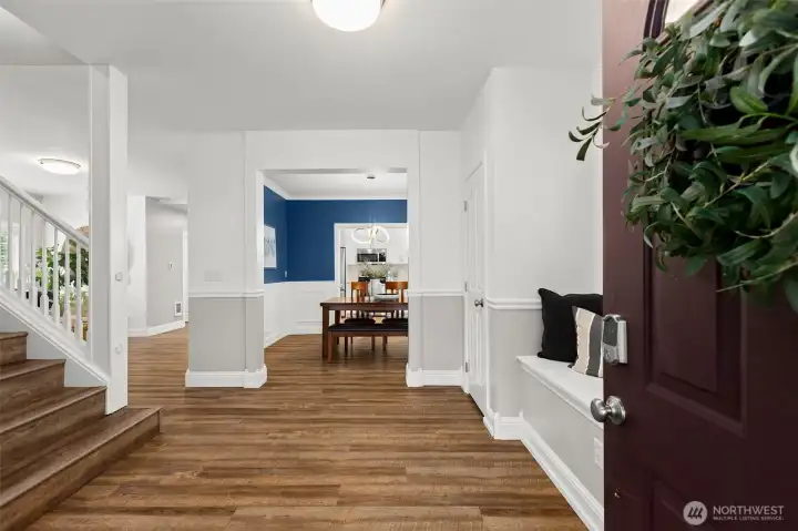 Your entry way, window seat bench with storage and a coat closet to the right.