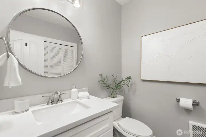 There is a 1/2 bath on main floor with laundry.