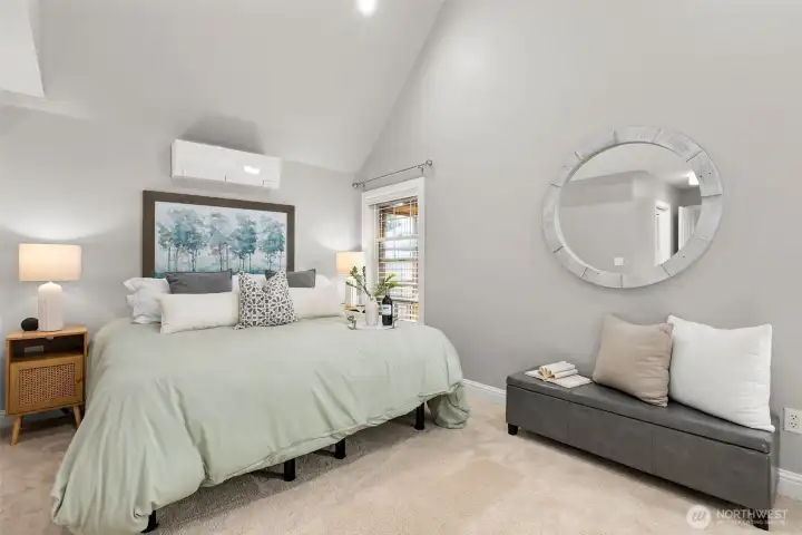 Primary Bedroom is complete with vaulted ceilings and airy vibes.