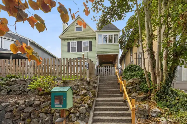 Your new home sits proudly above the street, taking advantage of peaceful views.  A "Tacoma Little Library" coupled with a Dog Treat cupboard are neighborhood favorites!  Darling!