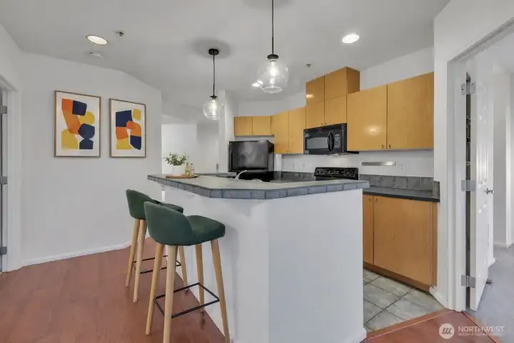 Virtually Staged kitchen with bar eating space.