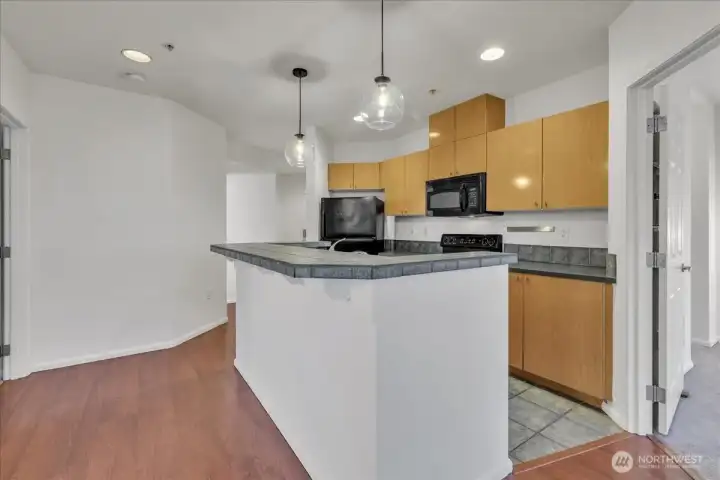 Open kitchen is centrally located and ready for you to come cook in!