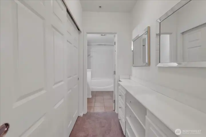 Large closet in primary bedroom with built-ins
