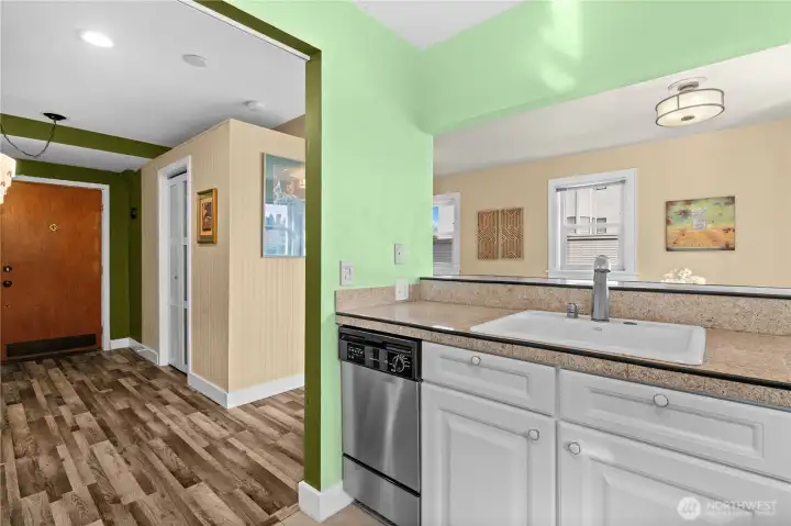 Looking out of kitchen towards unit entrance and living area