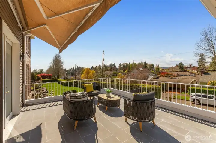 Deck off kitchen with retractable awning