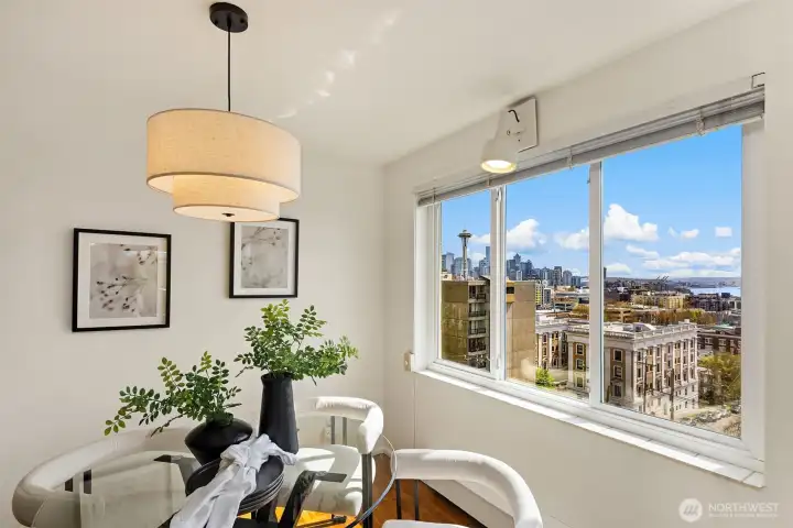 Dining area corner with a jaw-dropping window view of the Space Needle and downtown Seattle skyline from the 6th floor.