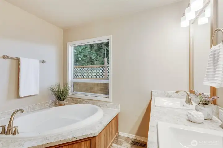 Relax and unwind in the modern soaking tub, a perfect retreat after a long day.