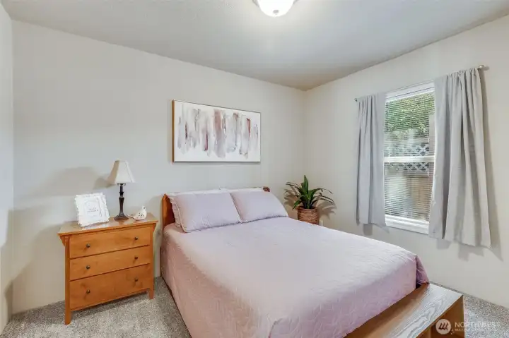 Bedroom 2 offers plenty of space and natural light, making it ideal for guests or a home office.