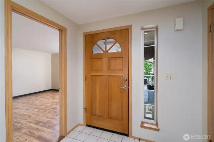 Step into the tiled foyer a classic entry to this 1-story home.