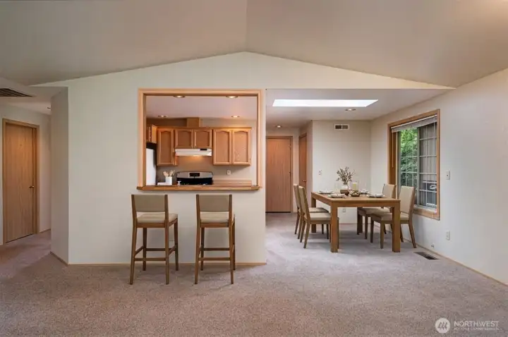 The raised bar offers a perfect spot to gather and chat.
